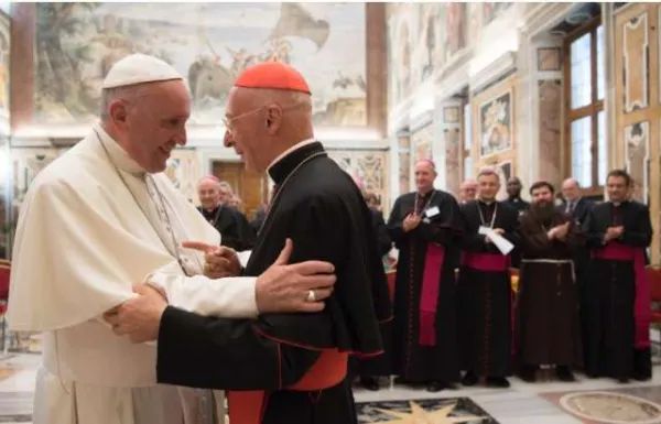 Pope Francis greets Cardinal Angelo Bagnasco at the end of an audience