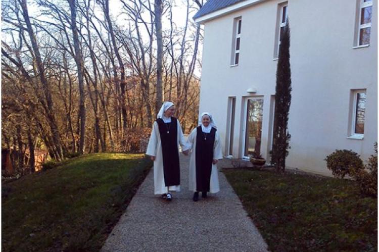 Sister Florence and Sister Marie-Ange walk the convent grounds